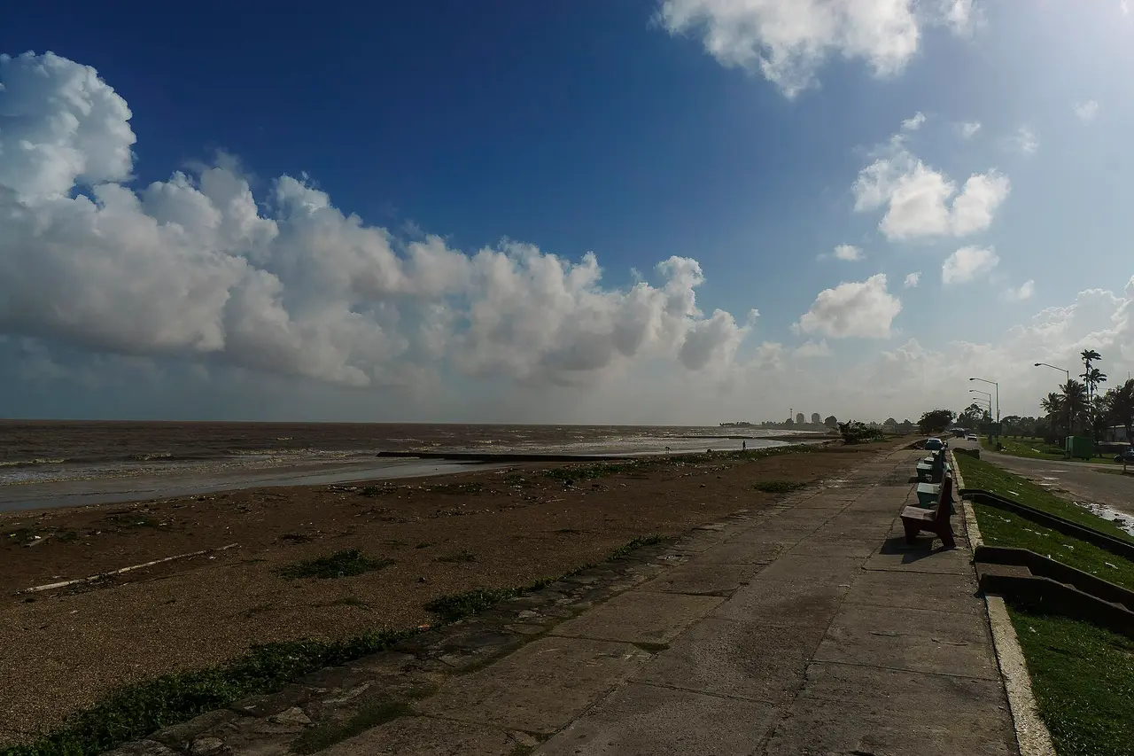 The Georgetown seawall promenade running along the Atlantic shore under a big sky